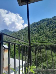 a balcony with a view of a mountain at family hostel in K'veda Bzubzu