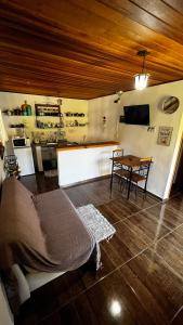 a living room with a bed and a table at Village Arcoverde - Visconde de Mauá in Bocaina de Minas +66 photos