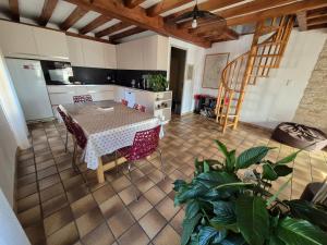 an aerial view of a kitchen and a table in a room at Maison cozy dans les Volcans in Sayat