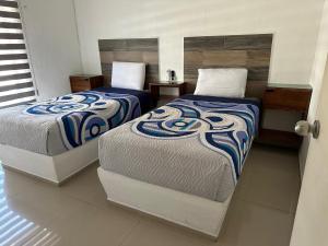 Giường trong phòng chung tại Padrisimo Departamento p6 personas en planta baja +39 ảnh
