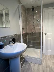 a bathroom with a sink and a shower at Cosy Town House in Bridgnorth in Bridgnorth