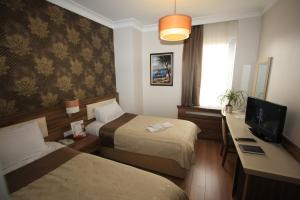 TV a/nebo společenská místnost v ubytování My Rose Hotel