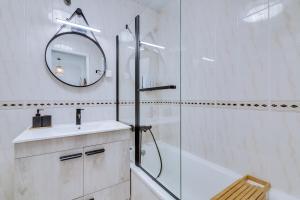a bathroom with a shower and a sink and a mirror at Brisa Algarvia 2 in Faro +21 photos