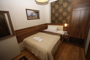 Postel nebo postele na pokoji v ubytování My Rose Hotel