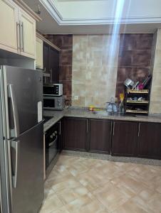 Η κουζίνα ή μικρή κουζίνα στο شقة جميلة +3 φωτογραφίες