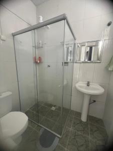 a bathroom with a shower and a toilet and a sink at Casa do açude in Triunfo +18 photos
