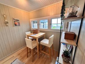 a small dining room with a table and chairs at The View Guesthouse at Ekeberg -10 min by tram to Oslo S in Oslo