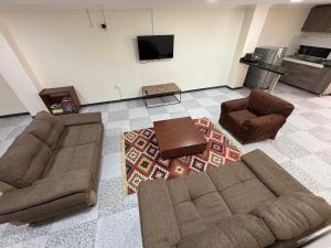 a living room with two couches and a tv at Apartamento Jaime Rook in Paipa