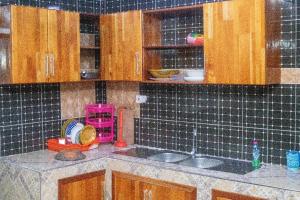 Kuchyň nebo kuchyňský kout v ubytování Ramana Suites