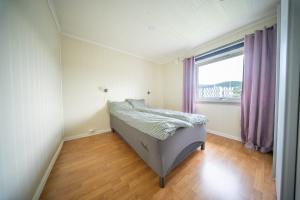 Ένα ή περισσότερα κρεβάτια σε δωμάτιο στο Andreas Lindsgate residence