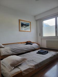 Katil atau katil-katil dalam bilik di Appartement Cosy