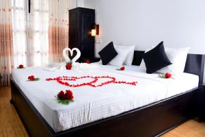 Ένα ή περισσότερα κρεβάτια σε δωμάτιο στο L&D Lodge