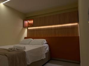 Ένα ή περισσότερα κρεβάτια σε δωμάτιο στο Flat Tamandaré em frente as piscinas naturais - Mila Rooftop