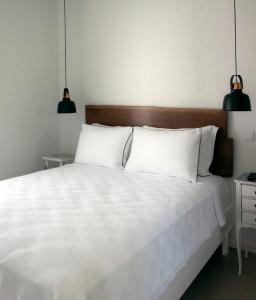 Postel nebo postele na pokoji v ubytování Sakula Hotel