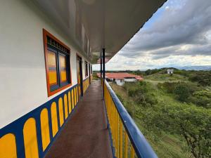a train station with a view of a field at Casa Quindiana in Zarzal +3 photos