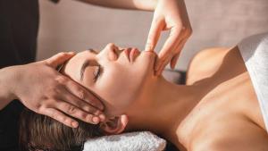 a woman getting her face massage at a spa at Massage studio-spa in Ginsheim-Gustavsburg