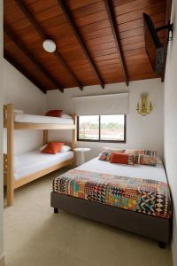 Postel nebo postele na pokoji v ubytování Mucho lo Bueno - Hostel House