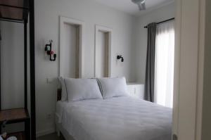 Postel nebo postele na pokoji v ubytování Sakula Hotel