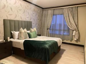 Ένα ή περισσότερα κρεβάτια σε δωμάτιο στο Soft 2 bedroom Retreat in Fourways, Sandton