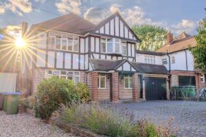 a brick house with the sun shining on it at STUNNING Character Home , Rustic Charm Meets Modern Living in Welling