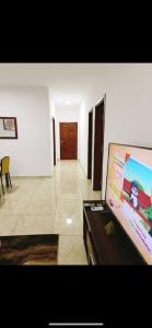 グラン・バッサムにあるResidence KBのリビングルーム(薄型テレビ付)