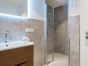 a bathroom with a shower and a sink at Holiday apartment with 2 bedrooms in Greetsiel +15 photos