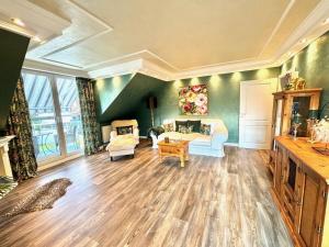 a living room with a couch and a table at One-bedroom apartment in Lantershofen