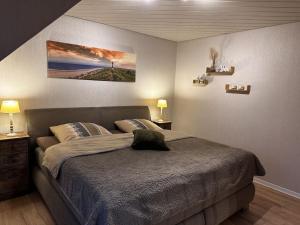 Postel nebo postele na pokoji v ubytování Holiday Apartment Lara Osteel