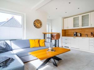 a living room with a couch and a table at Holiday apartment with 2 bedrooms in Greetsiel +17 photos