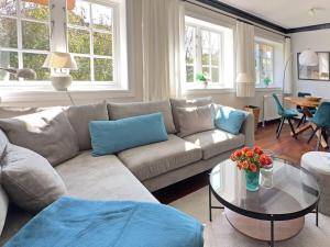 a living room with a couch and a table at Schroeder's House Kampen House 1B in Kampen
