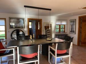 a kitchen with a large dining table and chairs at Luxurious holiday home Room No 7 in Tating