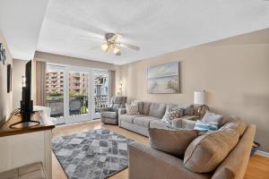 a living room with a couch and a ceiling fan at Wildwood Crest SeaPointe Village Condo condo in Diamond Beach +23 photos