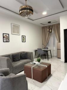a living room with a couch and a table at Dromi Apartments in Tantra Hill