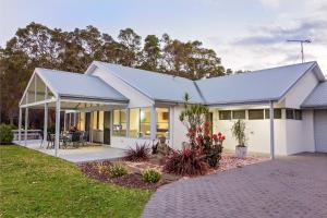 a white house with a lot of windows at Lilywood - Minutes from Wineries and Yallingup Beach in Yallingup