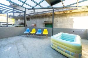 a group of chairs and a couch on a patio at 海燕民宿 in Suao