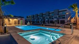 a swimming pool in front of a building at Spacious 5BR Resort Waterpark Access Sleeps 16 in Saint George Municipal Airport