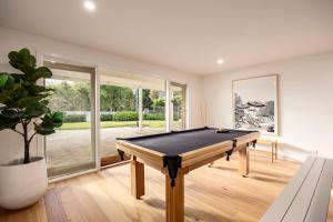 a living room with a pool table in it at Elizas Entertainer in Mount Eliza