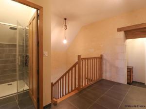 a bathroom with a walk in shower next to a staircase at Maison indépendante de charme avec jeux et animaux acceptés - FR-1-497-255 in Corbon +28 photos