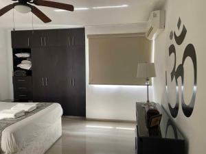 Ένα ή περισσότερα κρεβάτια σε δωμάτιο στο Tu lugar en Merida