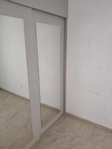 a mirror in the corner of a room at Hacienda Valbuena Antorcha area in León +7 photos