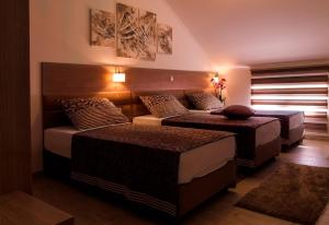Postel nebo postele na pokoji v ubytování Villa Martini - apartments & rooms