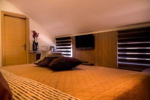Postel nebo postele na pokoji v ubytování Villa Martini - apartments & rooms