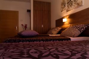 Postel nebo postele na pokoji v ubytování Villa Martini - apartments & rooms