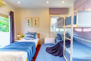 Postel nebo postele na pokoji v ubytování Seabreeze Family Retreat Pool Villa,Pet friendly