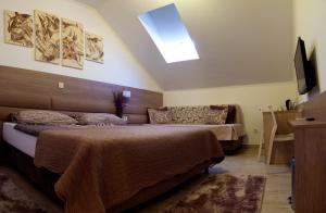 Postel nebo postele na pokoji v ubytování Villa Martini - apartments & rooms