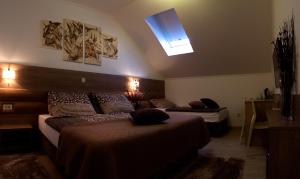 Postel nebo postele na pokoji v ubytování Villa Martini - apartments & rooms