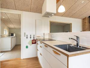 eine Küche mit Spüle und Arbeitsplatte in der Unterkunft 4 star holiday home in Frørup in Frørup + 30 Fotos