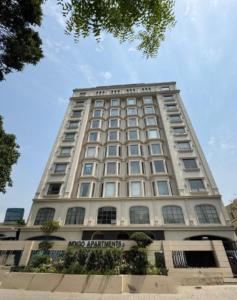 a large white building with a lot of windows at Indigo Luxury Premium Serviced Apartments Gulberg 3 - LMY Lahore in Lahore
