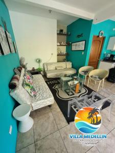 a living room with a couch and a table at Villa Medellin Monterrico in Taxisco