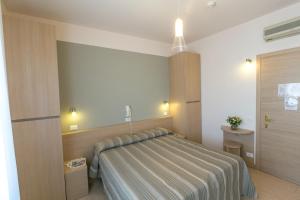 Voodi või voodid majutusasutuse Hotel Colonna toas